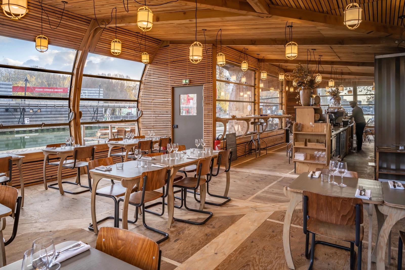 Wooden loft restaurant on the water's edge