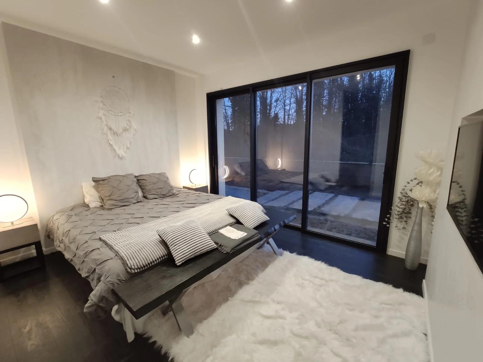 Dormitorio dentro Casa contemporánea en un entorno verde - 1