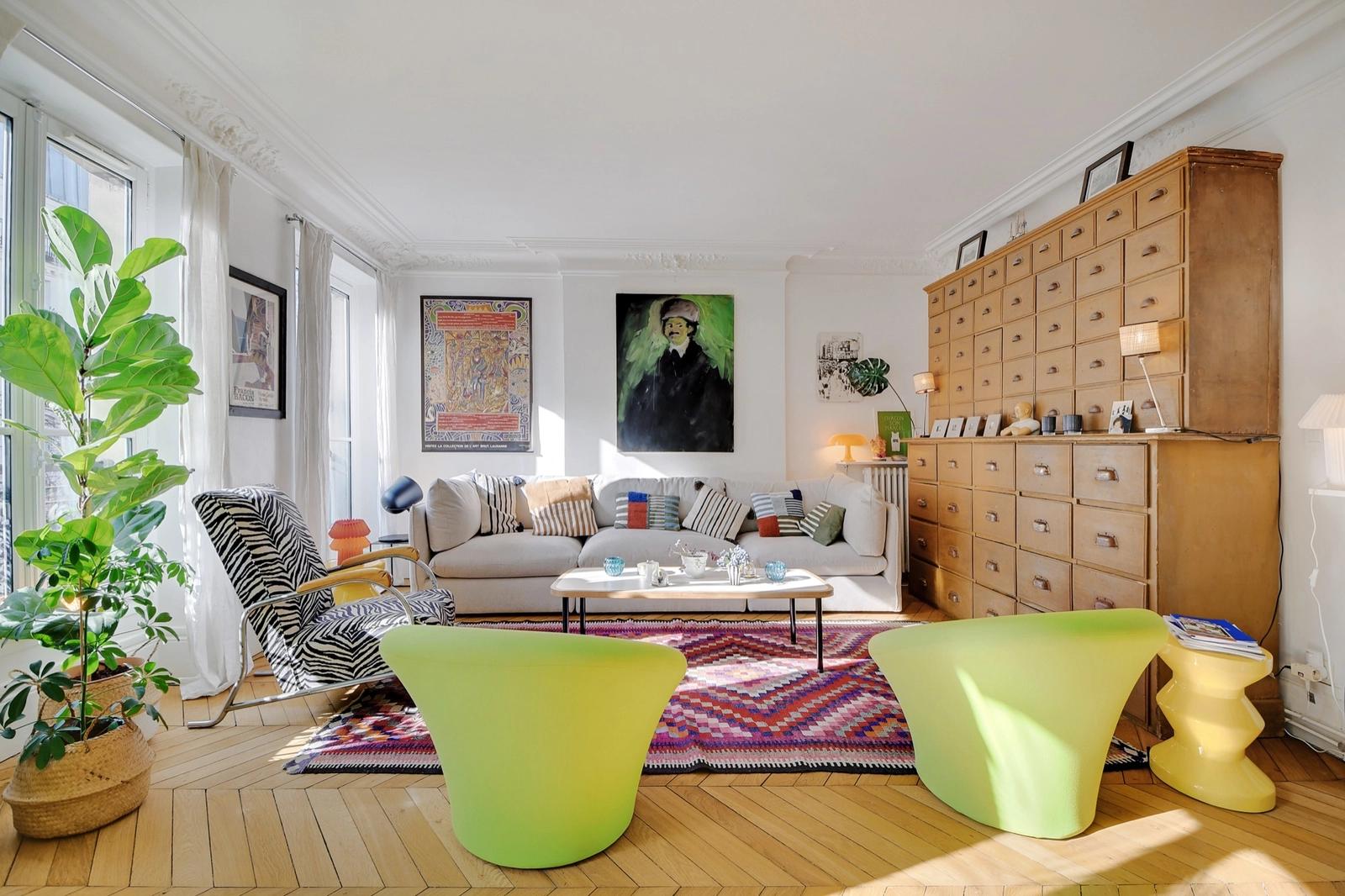 Living room in Typical Parisian apartment with bohemian decor - 4